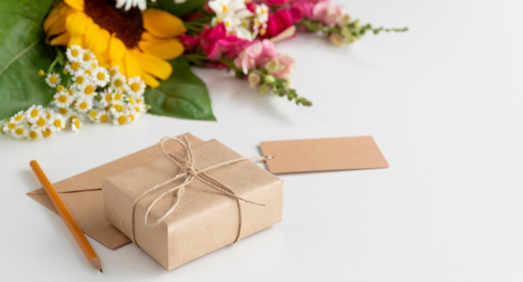 Students working on mobile game development projects in collaborative workspace